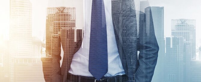 close up of businessman over city buildings